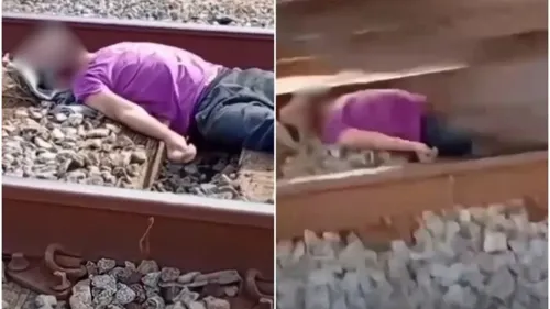 Homem se deitou com olhos vendados sobre os trilhos de trem