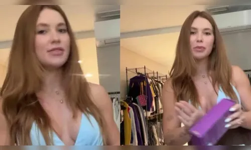 Em Madri pela 3ª vez, Virginia se grava em quarto com roupa masculina