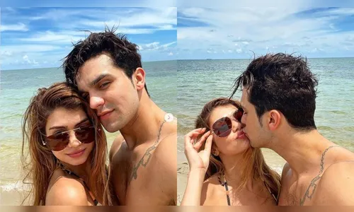 Luan Santana surge em clima de romance com a noiva na praia