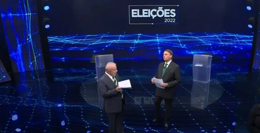 Lula e Bolsonaro durante debate na Band