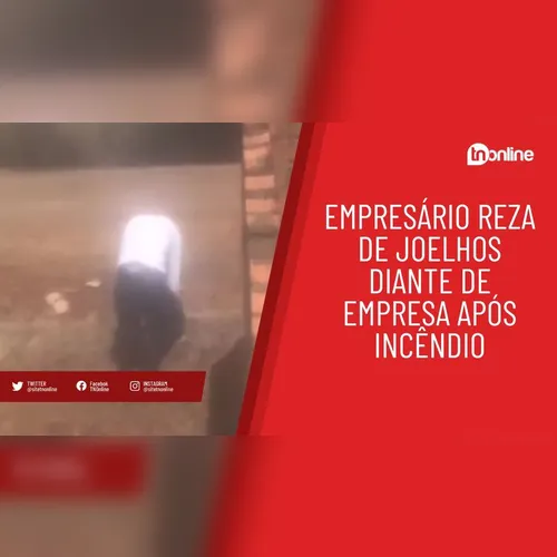 Empresário reza de joelhos diante de incêndio em sua empresa