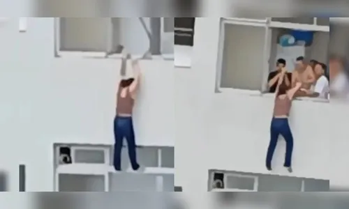Assustador! Mulher escorrega e fica pendurada em prédio