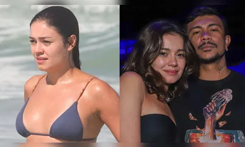 Sophie aparece saindo do mar com as mãos em sua barriga
