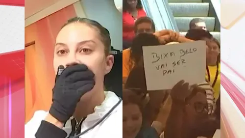 Reação de Renata ao ler o cartaz de um telespectador