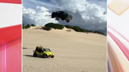 Veículo sobe a duna até praticamente voar por cima de um buggy