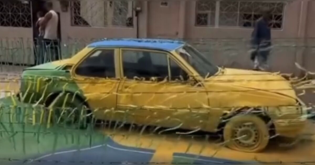 Moradores realizam arte em rua para a Copa e pintam carro qu