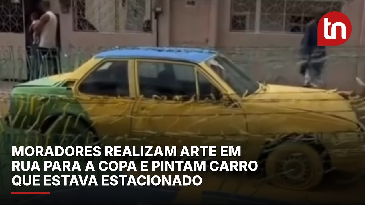 Moradores realizam arte em rua para a Copa e pintam carro que estava estacionado