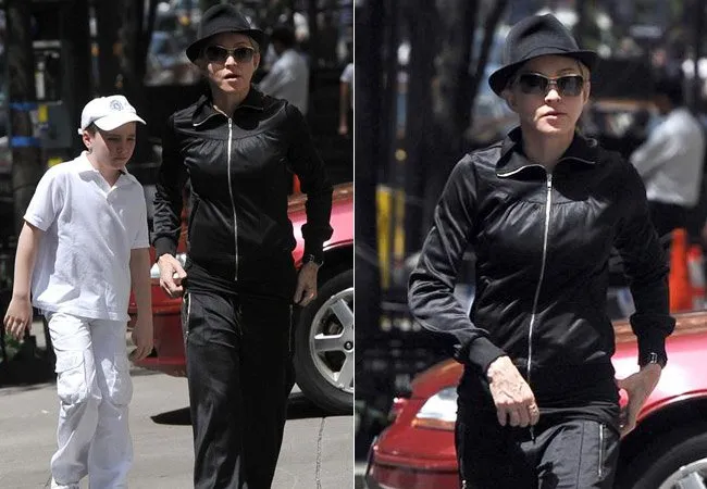  Madonna usou um chapéu preto e óculos escuros