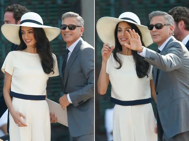 O ator americano George Clooney e a mulher, a advogada Amal Alamuddin, acenam ao chegar para o seu casamento civil, em Veneza, na Itália (Foto: Luc Bruno/AP)