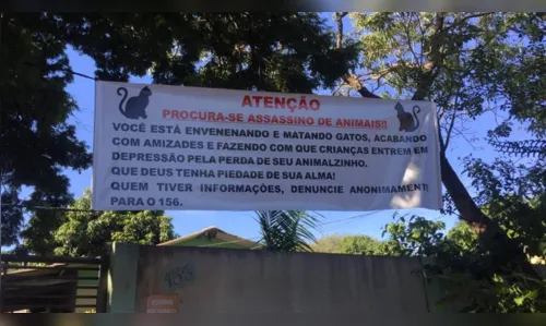 
						
							Moradores colocam faixas alertando para envenenamento de animais 
						
						