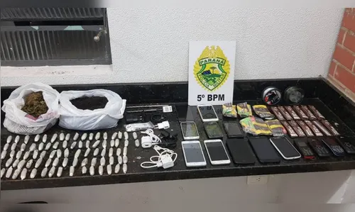 Jovem é detido tentando repassar drogas e celulares para o interior da PEL 1