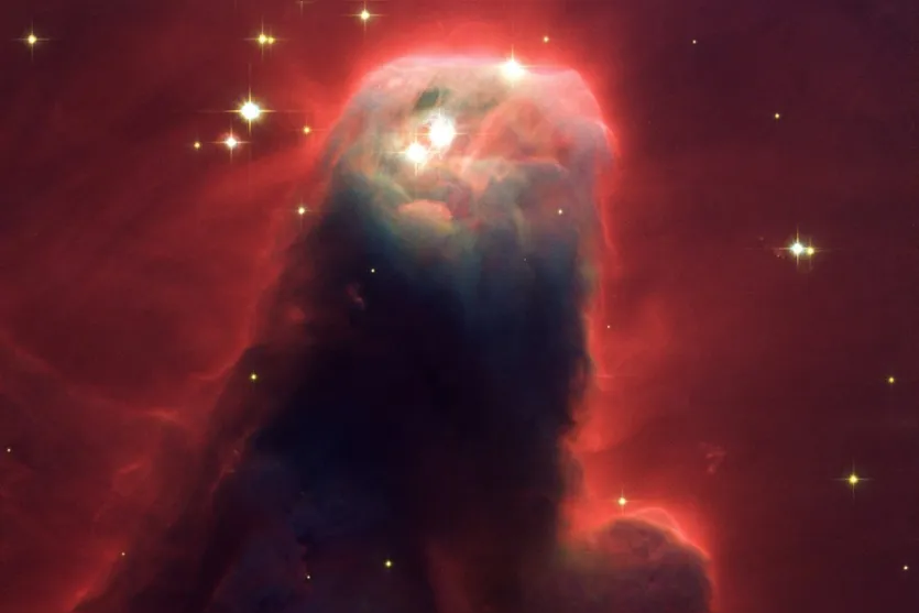   Formação estelar de gás e poeria fotografada pelo telescópio Hubble 