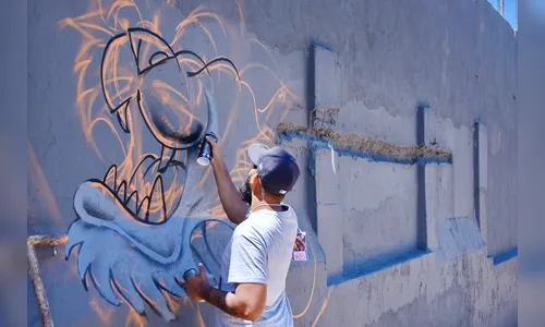 Encontro de grafiteiros colore os muros do Colégio Santos Dumont