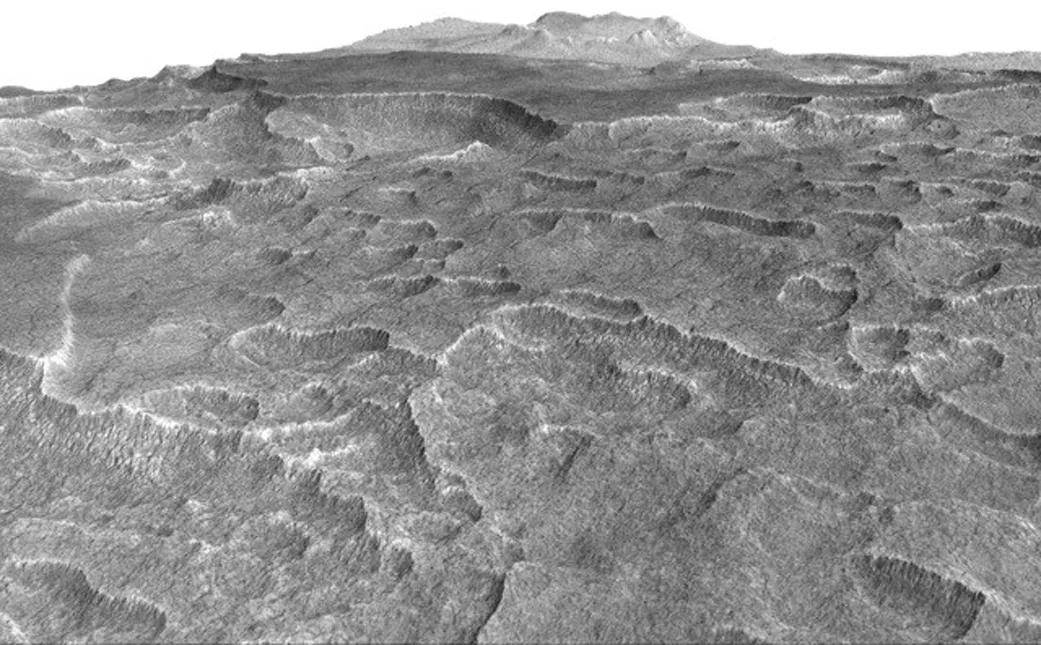 Visão vertical acentuada mostra depressões fendilhadas em uma parte de Marte: radar detectou água congelada Imagem: NASA / JPL-Caltech Univ. do Arizona